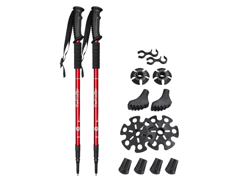 Red trekking poles with various interchangeable tips and accessories