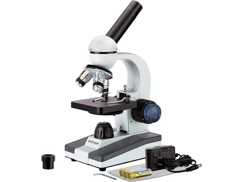 A microscope with various accessories and adjustable components