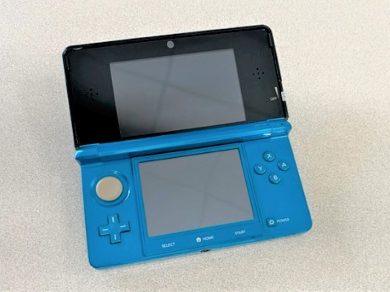 Blue Nintendo 3DS handheld gaming console with two screens open
