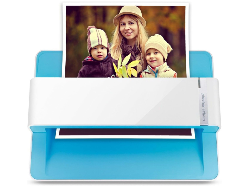 A photo scanner with a family portrait partially inserted