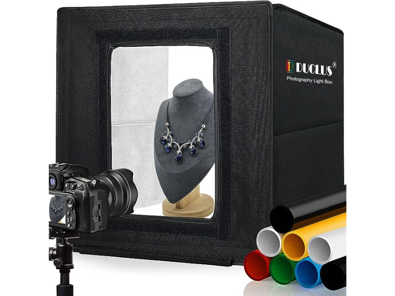 Photography light box showcasing a necklace on a display stand
