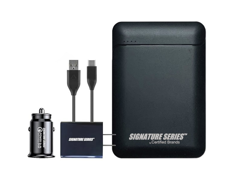 Black power bank travel kit with charging accessories and cables