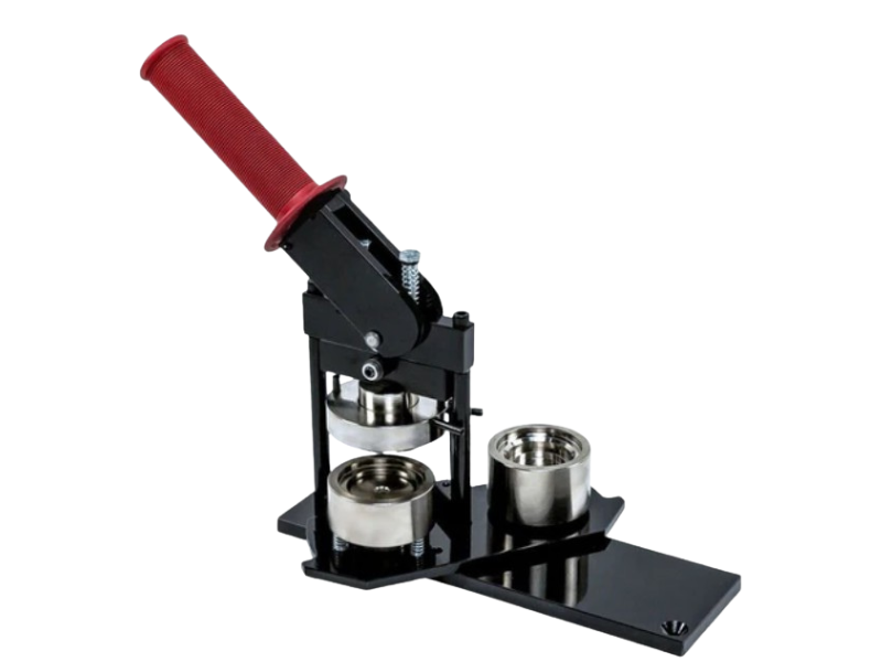 Button maker with a red handle and metal components