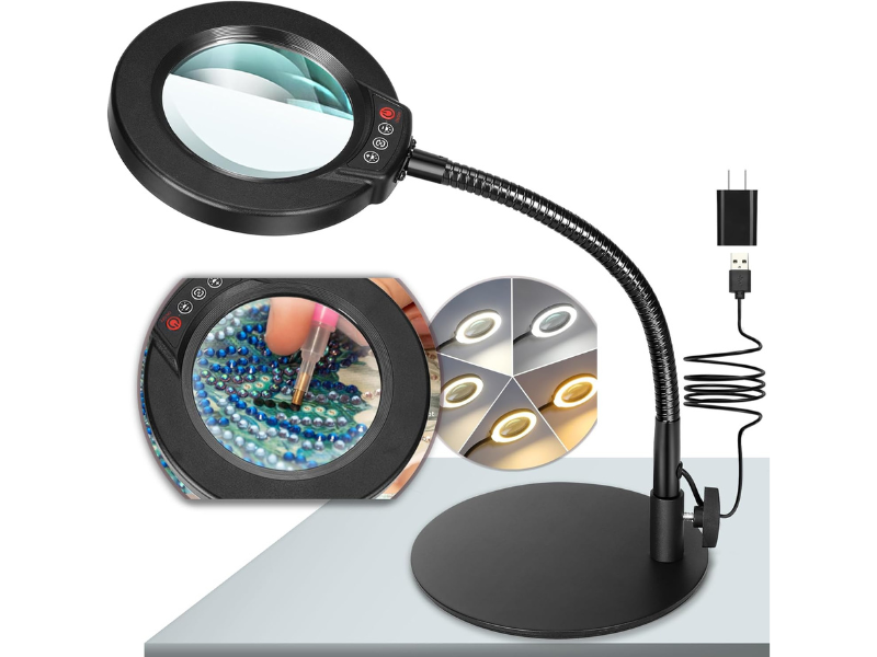 Magnifying desk lamp with adjustable arm and multiple light settings