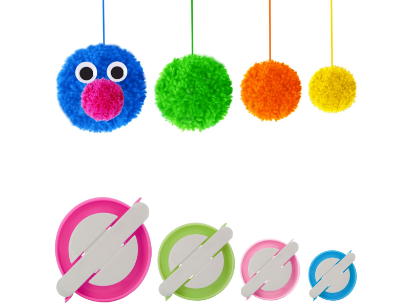 Colorful pom-poms and pom-pom makers in various sizes