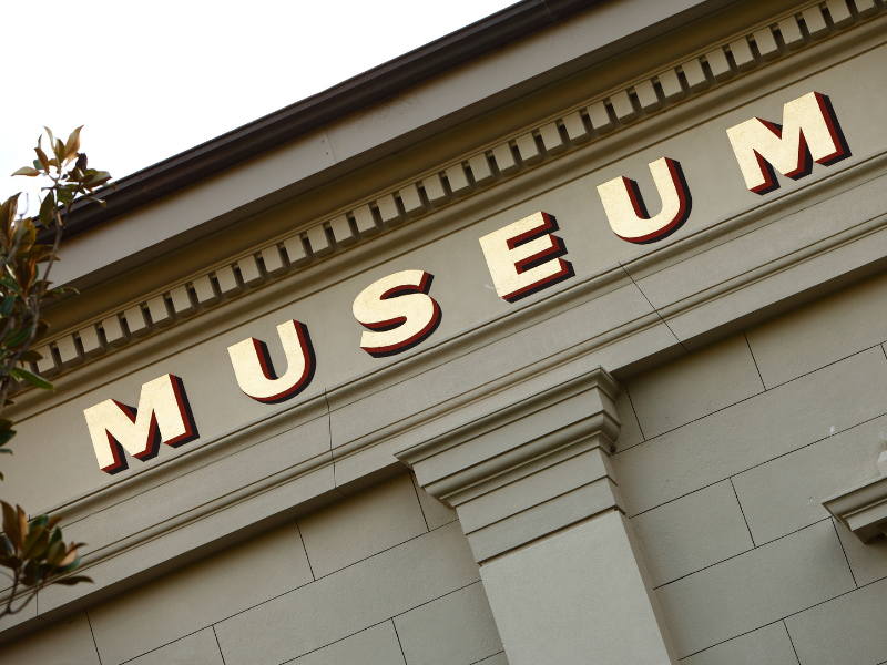 Museum sign displayed prominently on a building facade